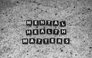 mental health matters written in black tiles